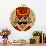 Finished nutcracker soldier portrait artwork displayed on a wall