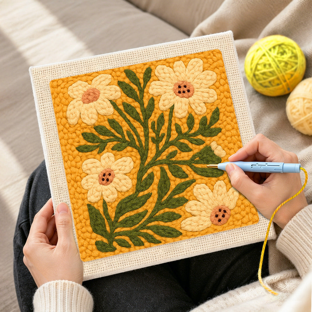 Creating handmade ochre yellow daisies punch needle artwork