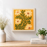 Finished ochre yellow daisies artwork displayed on a wall