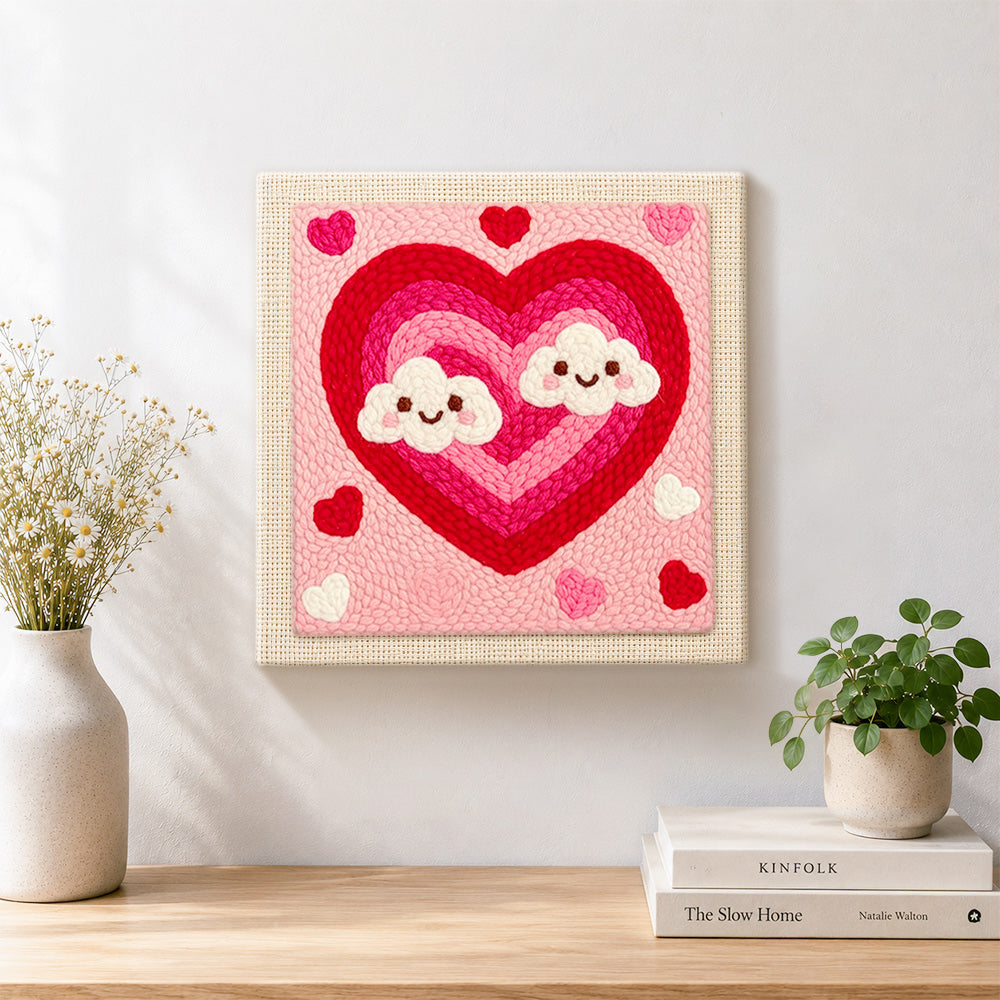 Finished ombre heart with kawaii clouds artwork displayed on a wall