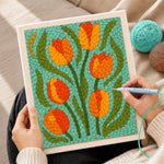 Creating handmade orange and yellow tulip flowers punch needle artwork