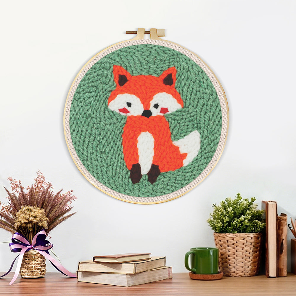 Finished orange baby fox artwork displayed on a wall
