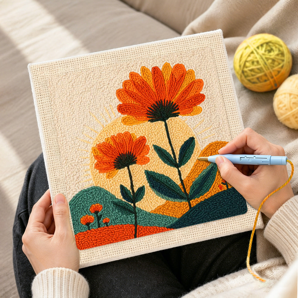 Creating handmade orange flowers and radiant sunset punch needle artwork