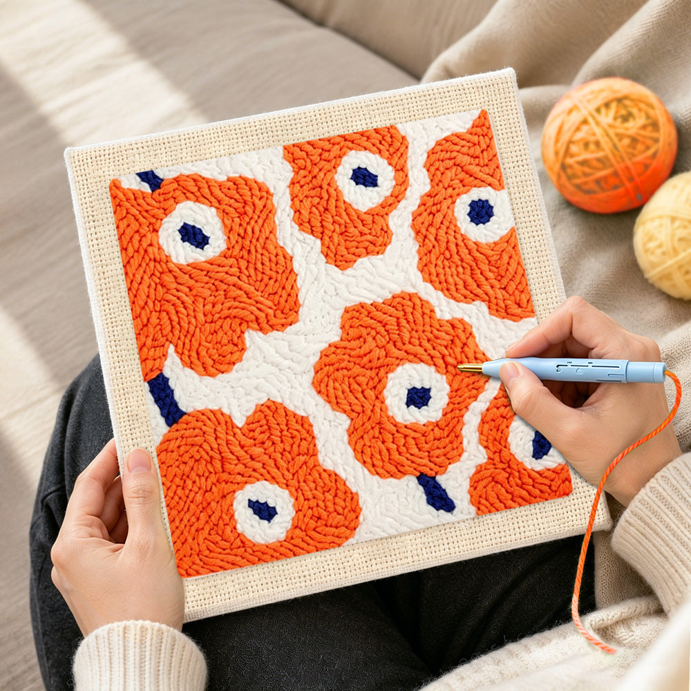 Creating handmade orange flowers punch needle artwork