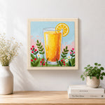 Finished orange juice and some wildflowers artwork displayed on a wall