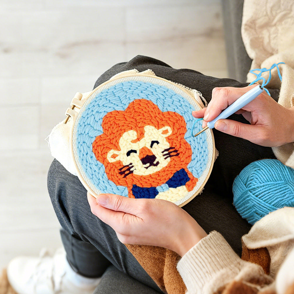Creating handmade orange-maned cartoon lion punch needle artwork