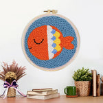 Finished orange sea fish artwork displayed on a wall