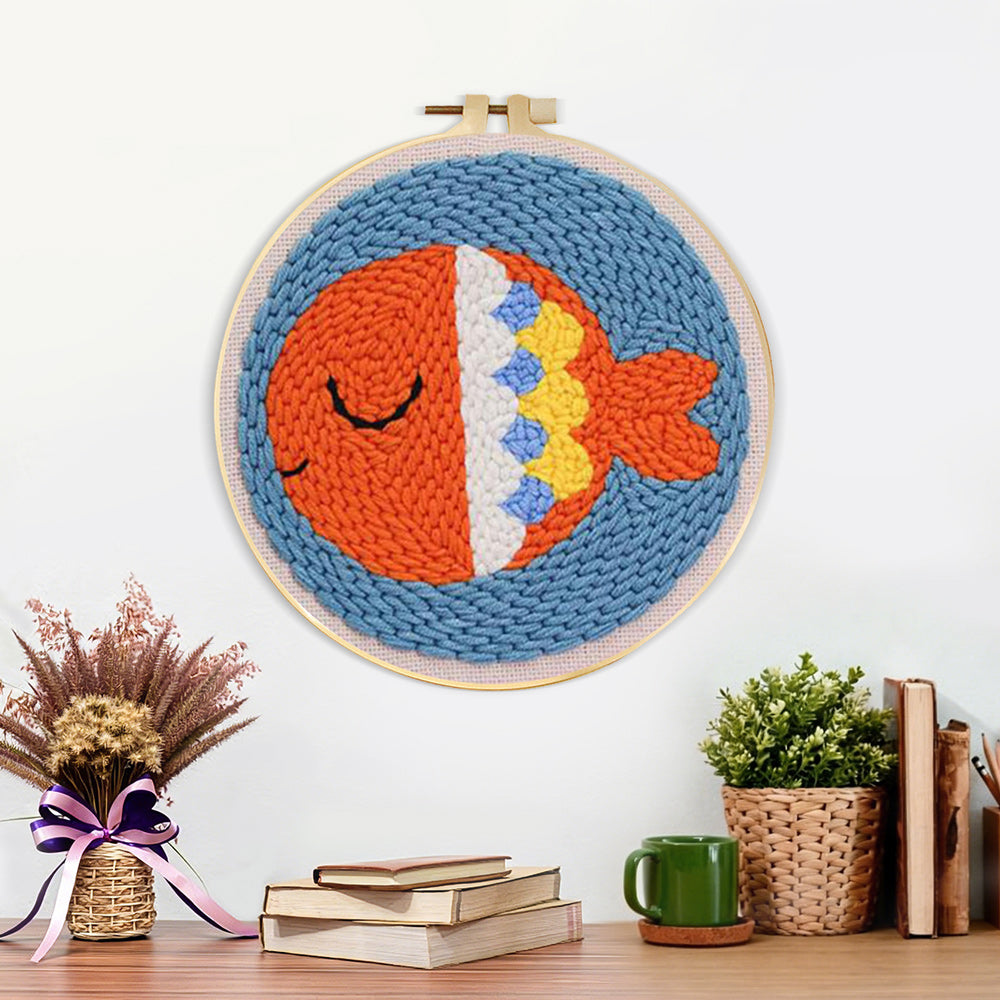 Finished orange sea fish artwork displayed on a wall