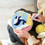 Creating handmade orca and moon punch needle artwork