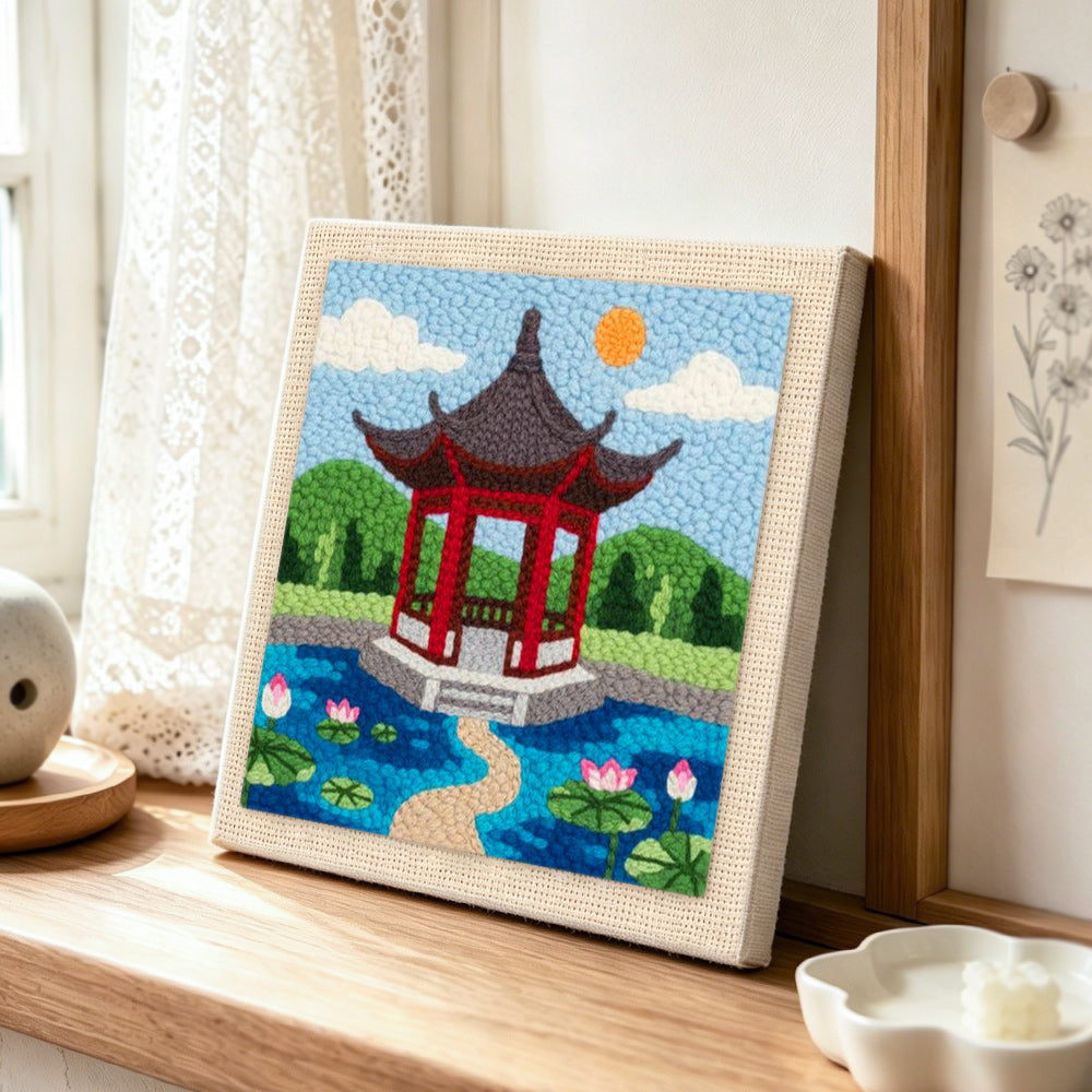 Oriental garden pavilion punch needle artwork displayed on a table
