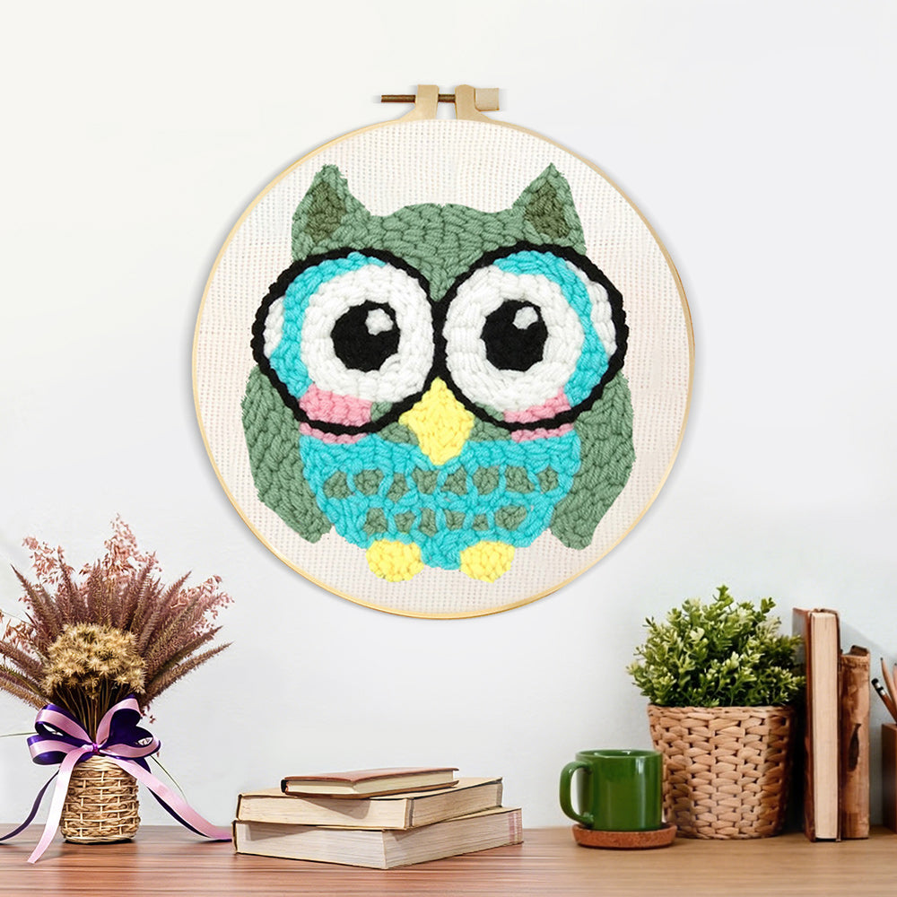 Finished owl with glasses artwork displayed on a wall