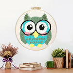 Finished owl with glasses artwork displayed on a wall