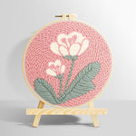 Pale pink background with white flowers punch needle kit for beginners