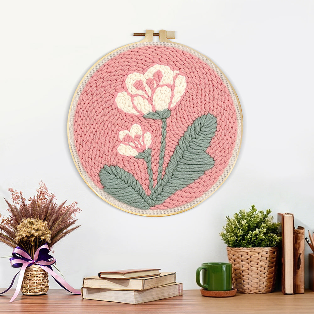 Finished pale pink background with white flowers artwork displayed on a wall