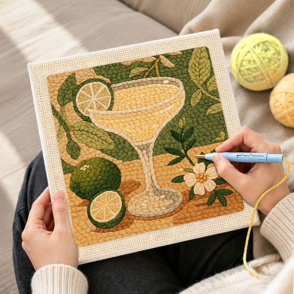 Creating handmade pale yellow cocktail with lime punch needle artwork