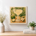 Finished pale yellow cocktail with lime artwork displayed on a wall