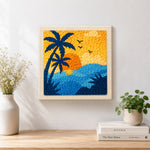 Finished palm tree and ocean artwork displayed on a wall