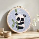 Panda and bamboo punch needle artwork displayed on a table