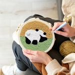 Creating handmade panda in the meadow punch needle artwork