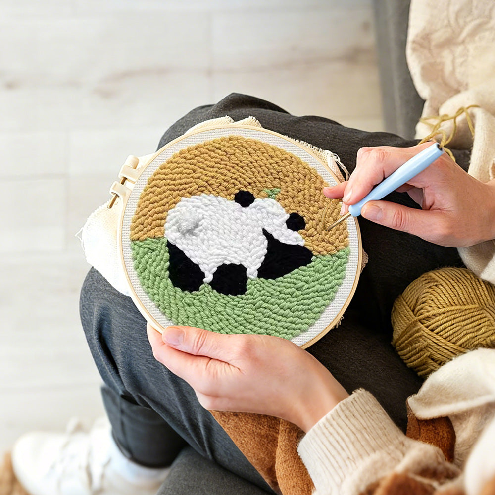 Creating handmade panda in the meadow punch needle artwork