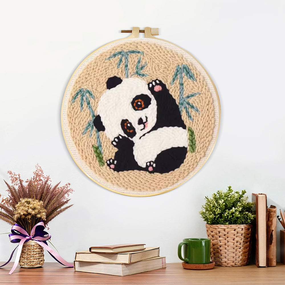 Finished panda stretching artwork displayed on a wall