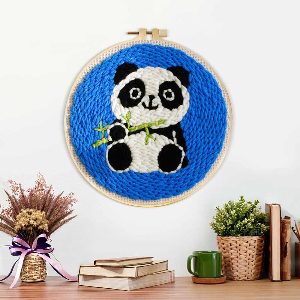 Finished panda with bamboo artwork displayed on a wall