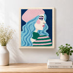 Finished pastel blue haired woman in pink beret artwork displayed on a wall