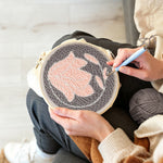 Creating handmade pastel pink flower punch needle artwork