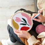 Creating handmade pastel pink tulip punch needle artwork