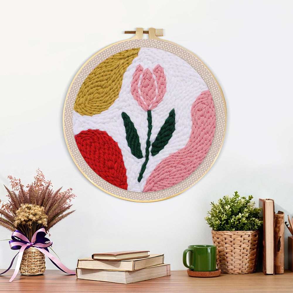 Finished pastel pink tulip artwork displayed on a wall