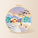 Pastel twilight snowy cabin needle felting kit for beginners with a round wooden frame