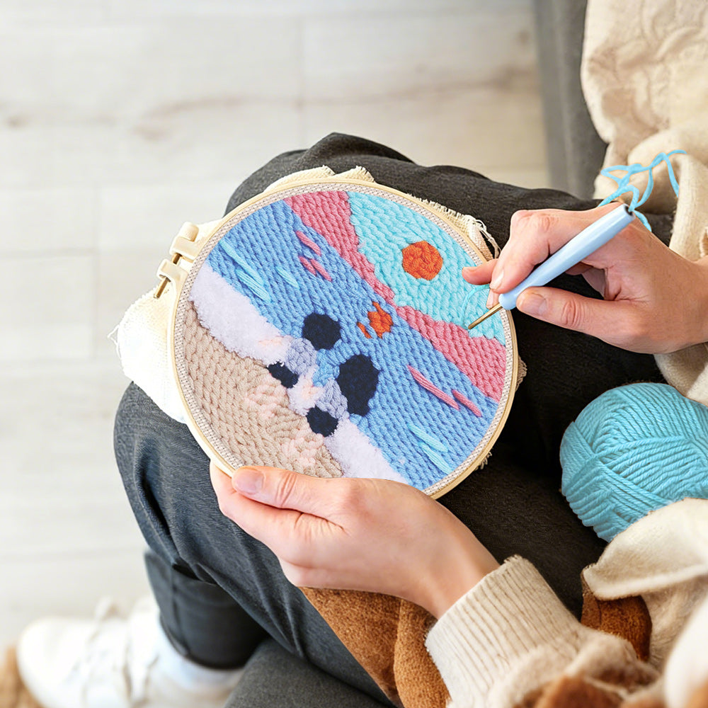 Creating handmade peaceful beach view with couple punch needle artwork