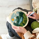 Creating handmade peaceful mountain and lake punch needle artwork