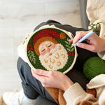 Creating handmade peaceful santa claus portrait punch needle artwork