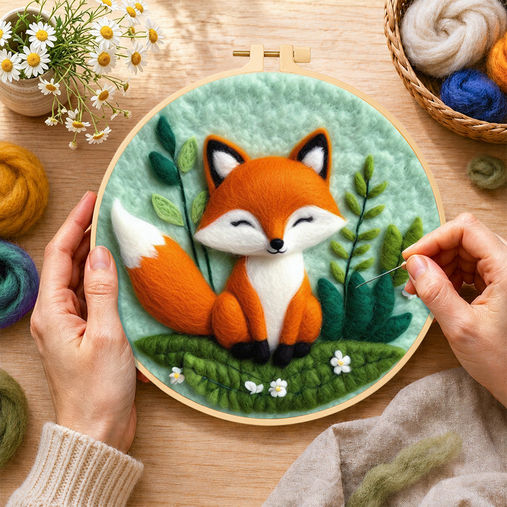 Creating the peaceful sleeping fox wool painting by hand with a felting needle