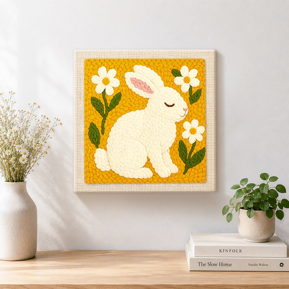 Finished peaceful white bunny with daisies artwork displayed on a wall