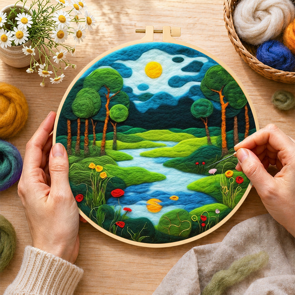 Creating the peaceful woodland river wool painting by hand with a felting needle