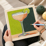 Creating handmade peach drink with lime garnish punch needle artwork