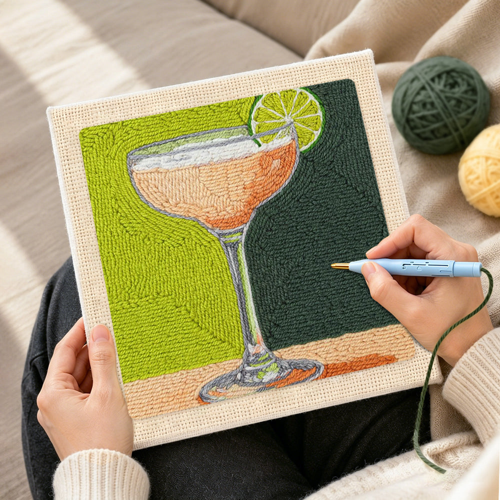 Creating handmade peach drink with lime garnish punch needle artwork