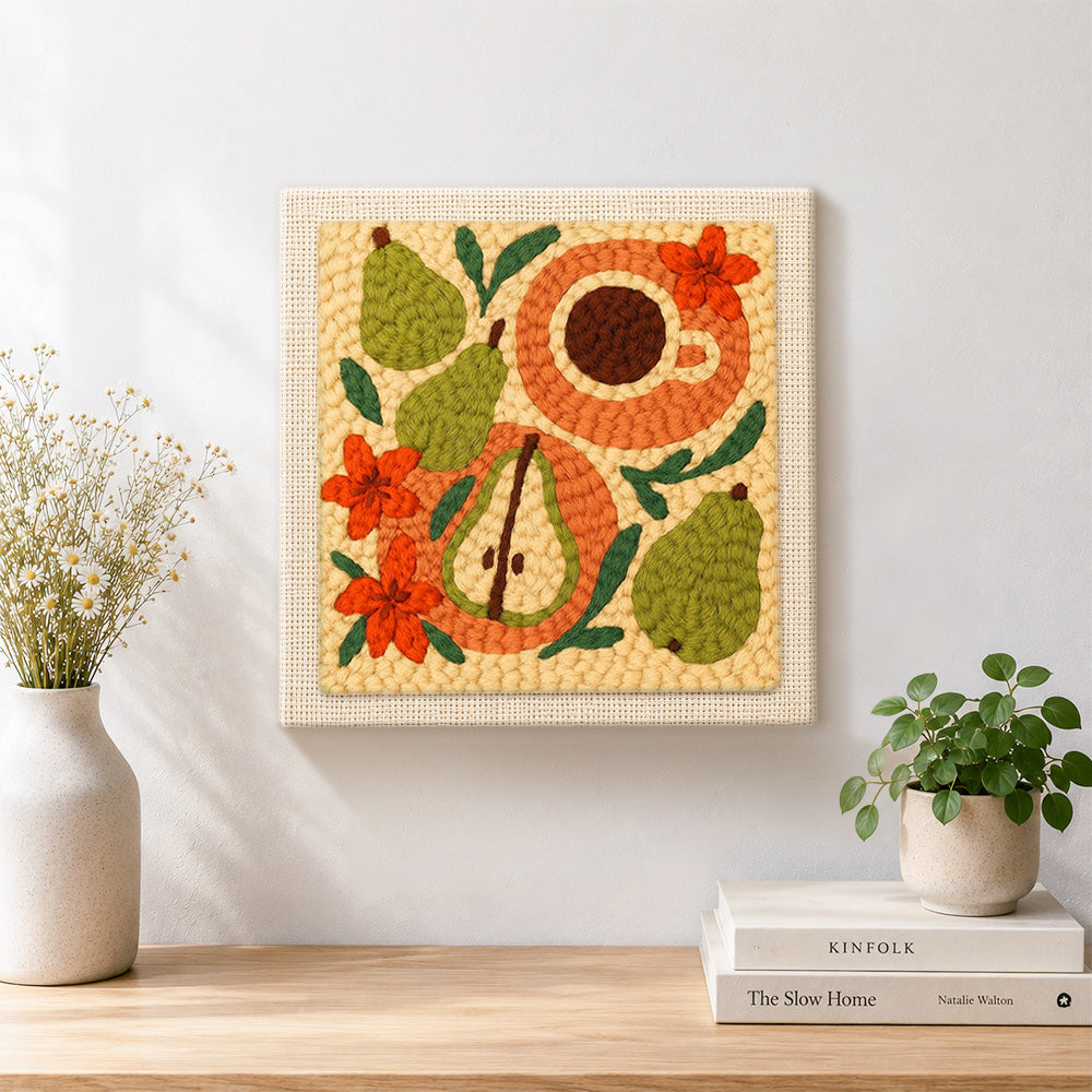 Finished pear, coffee and flowers artwork displayed on a wall