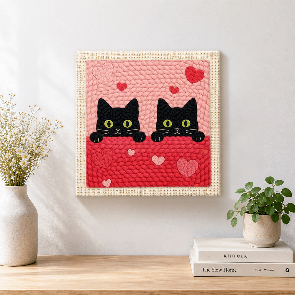 Finished peeking black cat duo with green eyes artwork displayed on a wall