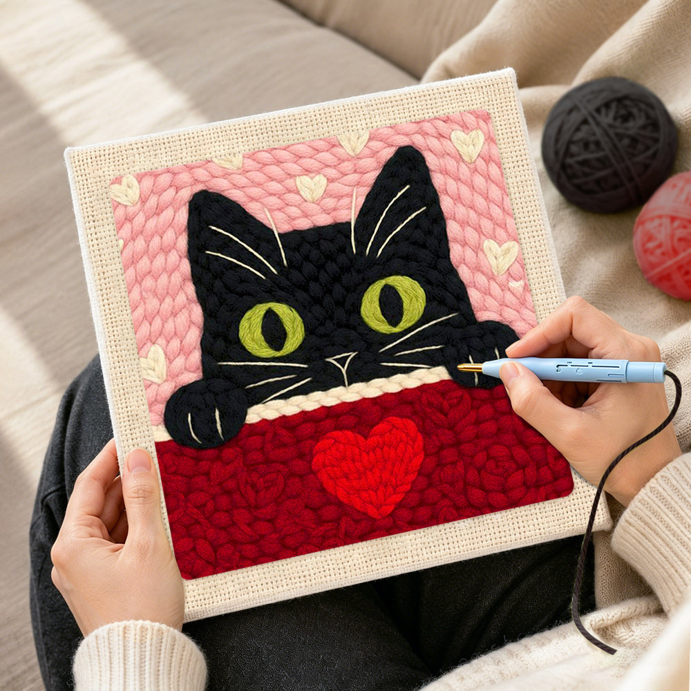 Creating handmade peeking black cat with green eyes punch needle artwork