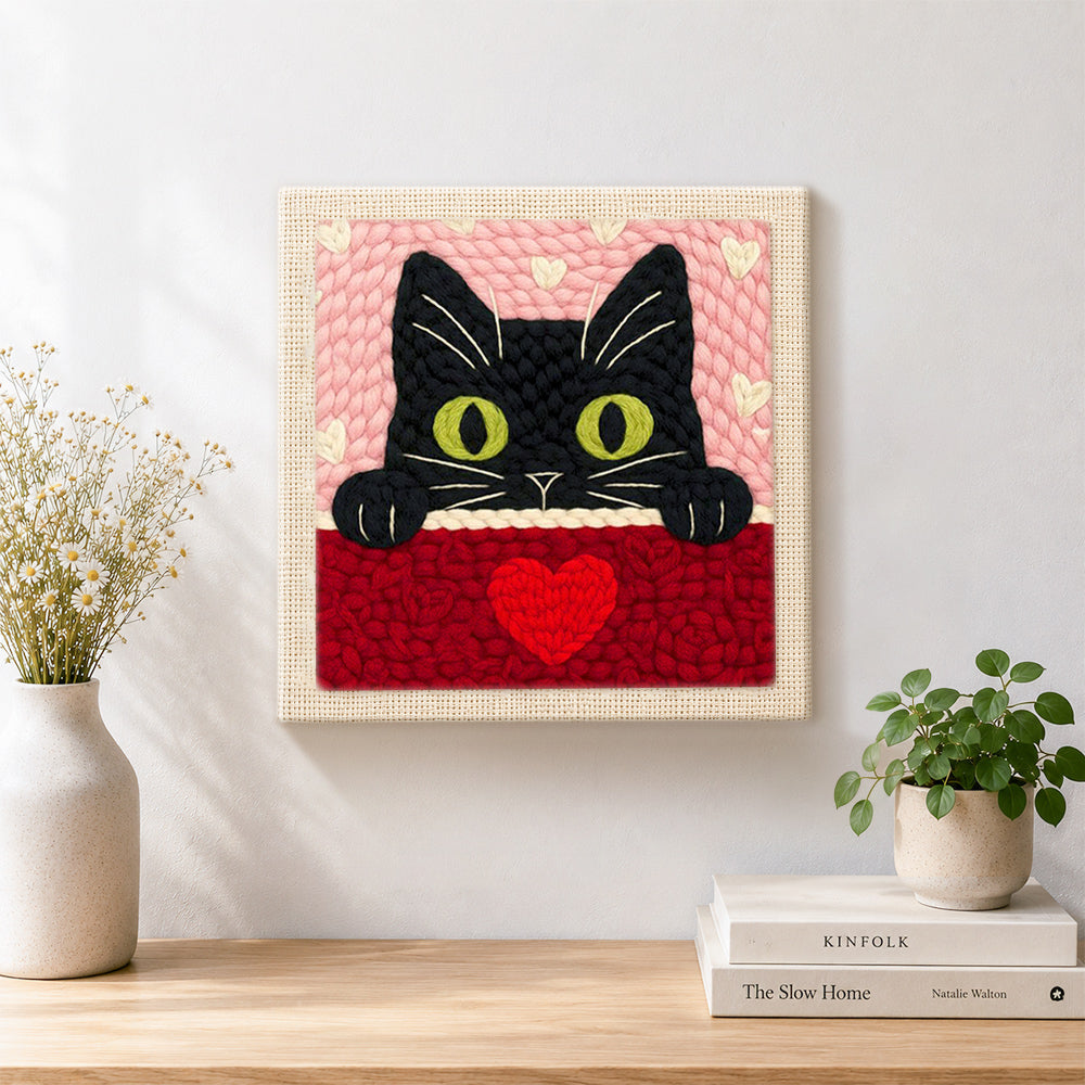 Finished peeking black cat with green eyes artwork displayed on a wall