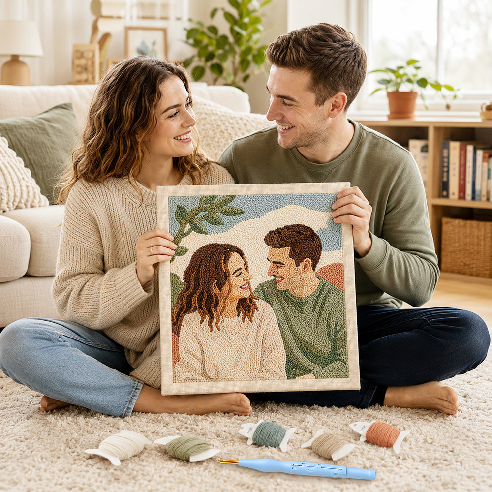 Couple holding a personalised punch needle artwork made from their photo as a handmade gift keepsake