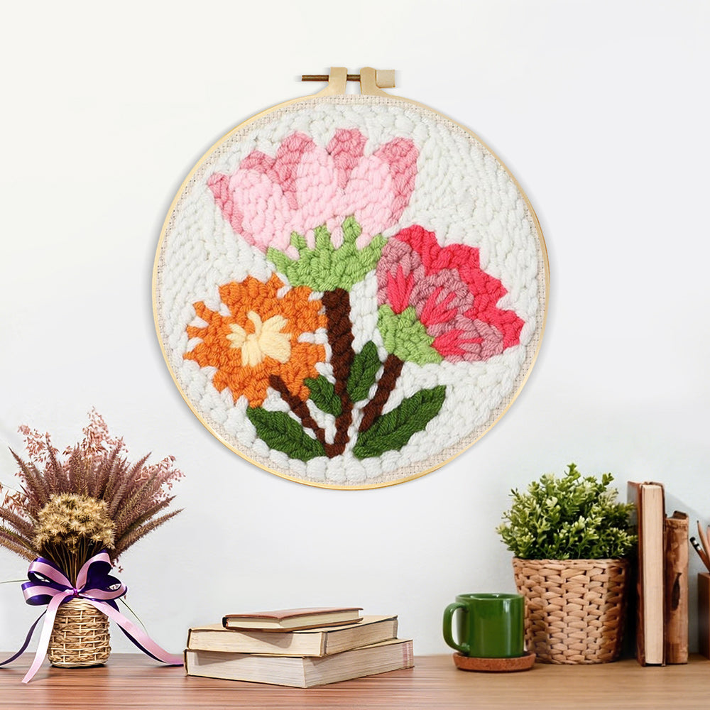 Finished pink and orange blooms bouquet artwork displayed on a wall