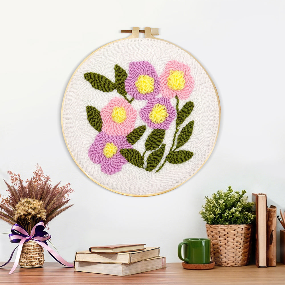 Finished pink and purple bloom cluster artwork displayed on a wall