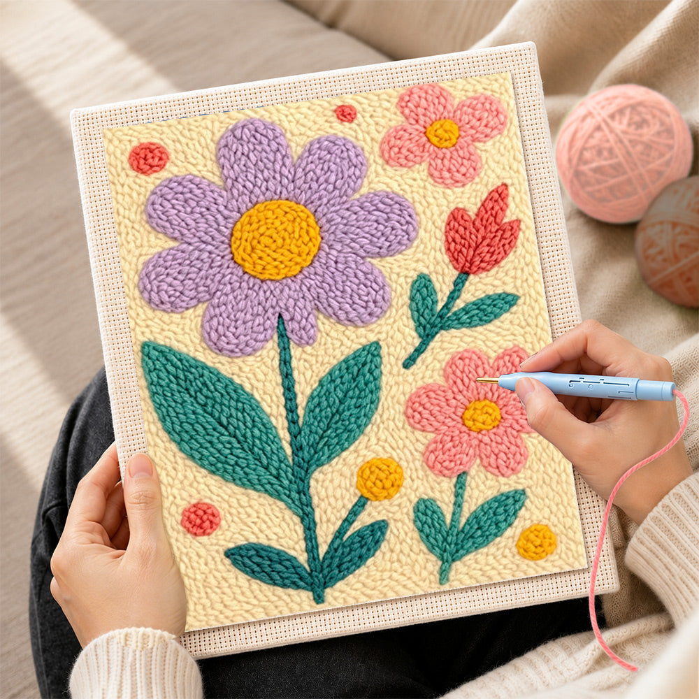 Creating handmade pink and purple flowers punch needle artwork