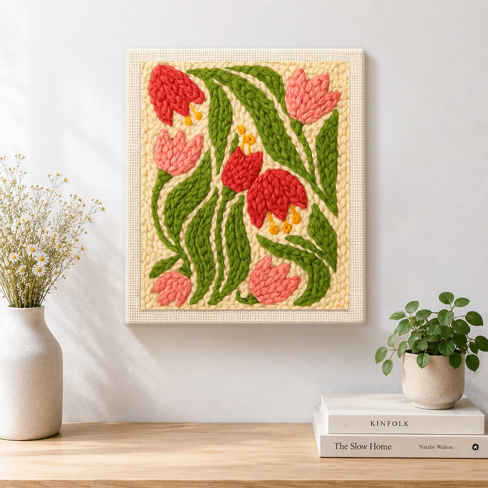 Finished pink and red bell flowers artwork displayed on a wall