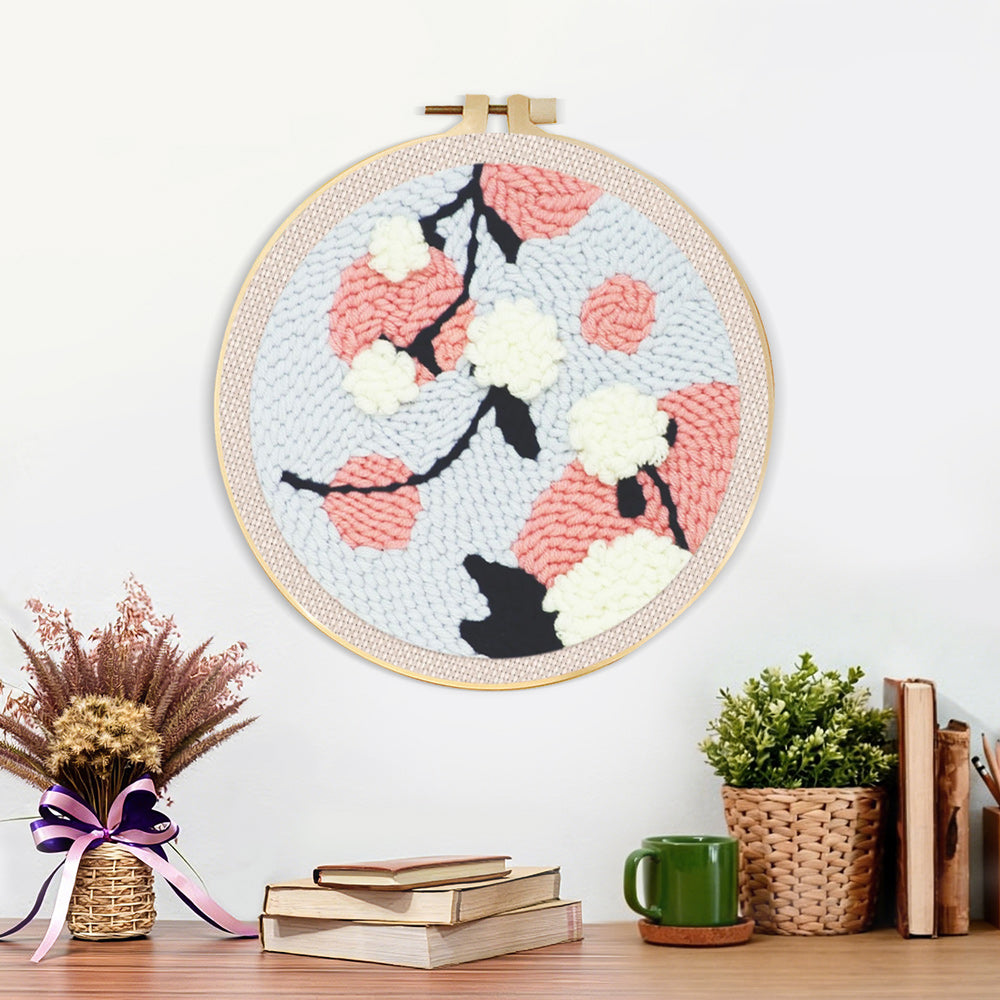 Finished pink and white blossoms artwork displayed on a wall