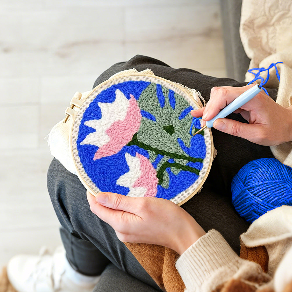 Creating handmade pink and white lotus punch needle artwork